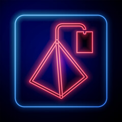 Glowing neon Tea bag icon isolated on black background. Vector