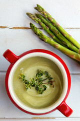 Asparagus soup in a red bowl