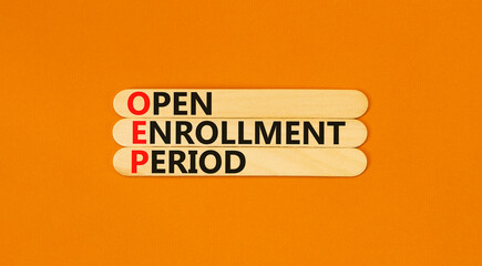 OEP symbol. Concept words OEP Open enrollment period on beautiful wooden sticks. Beautiful orange...