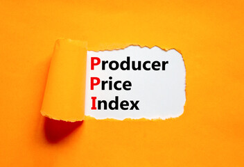 PPI Producer price index symbol. Concept words PPI Producer price index on white paper. Beautiful orange table orange background. Business and PPI Producer price index concept. Copy space.