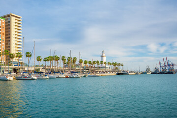 Lighthouse called La Farola at Port of Malaga Muelle Uno - Malaga, Andalusia, Spain