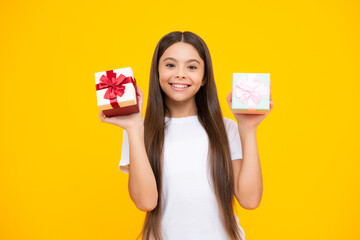 Happy teenager portrait. Cute teenager child girl congratulate with valentines day, giving romantic gift box. Present, greeting and gifting birthday concept. Smiling girl.