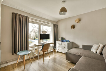 Fototapeta premium a living room with a couch, chair and television set in the middle of the room there is a window that looks out to