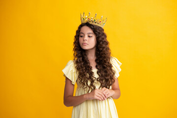 Little queen wearing golden crown. Teenage girl princess holding crown tiara. Prom party, childhood...