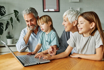child laptop home family grandparent computer together grandmother technology online adult girl...