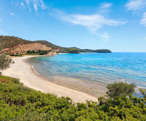 Fototapeta na wymiar Summer Aegean Sea coast landscape with sandy beach and wild camping (Sithonia, Halkidiki, Greece).