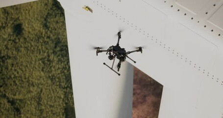AERIAL Industrial drone flying near wind turbine, gathering video data for inspection and service