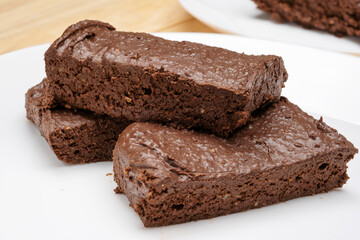 Delicate, soft chocolate banana dessert, cupcake on a white platter. 