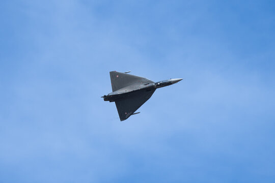 FIghter jet in sky maneuver and takeoff.