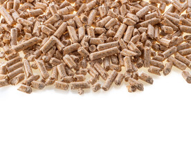Wood pellets; full frame close up in top view, on white background, copy space