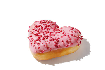 Heart shaped donut with glaze on white background