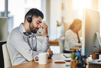Headache, stress or tired man in call center with burnout, head pain or overworked in crm communication. Migraine, office or telemarketing sales agent frustrated with anxiety, fatigue or problems