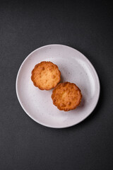 Delicious baked cupcake or tartlet with cheese and raisins