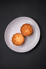 Delicious baked cupcake or tartlet with cheese and raisins