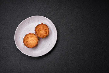 Delicious baked cupcake or tartlet with cheese and raisins