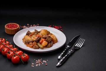 Delicious stew with potatoes, tomatoes, beef, onions and carrots