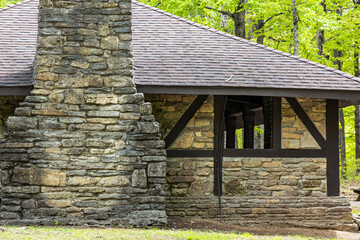 Close-up of a stone shelter in a state park with a large chimney built by the Conservation Corps.