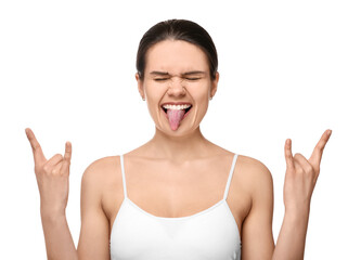 Happy young woman showing her tongue and rock gesture on white background