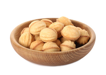 Plate of delicious nut shaped cookies with condensed milk on white background