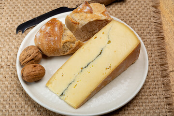 Cheese collection, French Morbier semi-soft cow milk cheese with black mold layer