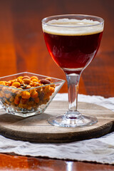 Glass of Belgian abbey brown beer in bar