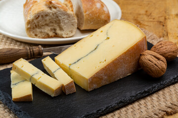 Cheese collection, French Morbier semi-soft cow milk cheese with black mold layer