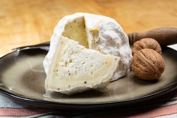 Cheese collection, soft cow French cheese with mold Gaperon artisanal lavored with cracked peppercorns and garlic produced in Auvergne