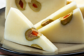 Cheese collection, fresh Italian pecorino cheese made from sheep milk filled with green olives...