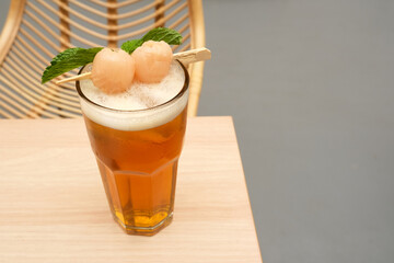 Lychee iced tea with mint leaves
