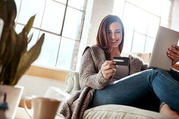 Smile, tablet and credit card, happy woman on couch in living room and internet banking or fintech in home. Technology, online shopping payment and girl on sofa surfing retail website or digital shop - obrazy, fototapety, plakaty