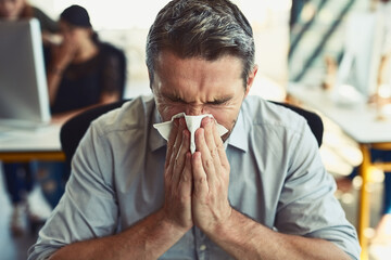Sick businessman, tissue and blowing nose with allergies, flu or fever from illness at the office....