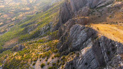Huge cliffs with forest at summer. Beautiful nature miracle in Turkey. National park area. Pure untouched nature. Dense mixed forest at the top of a mountain cliff.