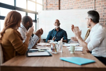 Business people, meeting and applause of black man in office for achievement, goal or target. Excited, clapping and senior African male professional with group of employees in celebration of success.