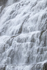 Waterfall Water Texture. Pure water background. Beautiful Nature in Iceland. Powerful Mountain River. Huge Water Stream, Infinite Natural Energy. Travel Europe. Dynjandi.