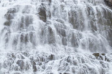 Waterfall Water Texture. Pure water background. Beautiful Nature in Iceland. Powerful Mountain River. Huge Water Stream, Infinite Natural Energy. Travel Europe. Dynjandi.