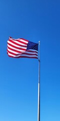 American flag against blue sky