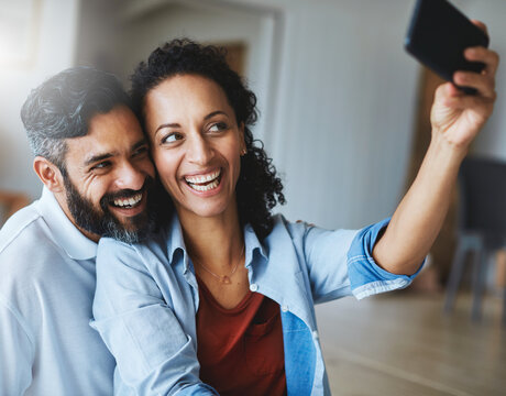 Happy couple, smile and selfie for profile picture, social media or vlog together relaxing at home. Man and woman in relationship smiling for photo, online post or memory and bonding in living room