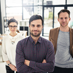 Portrait, teamwork and leadership with a business man and his team standing in the office together. Management, leader and collaboration with a group of businesspeople looking confident about work