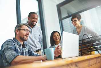 Teamwork, laptop and training with business people in meeting for project management, review or planning. Technology, website and coaching with group of employees in office for collaboration and idea