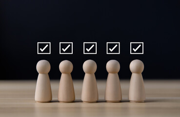 wooden block showing check mark Checklist ideas in business surveys and questionnaires copy space