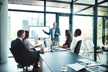 Business, charts and man with presentation, office and conversation for project, profit growth and meeting. Male leader, staff or group with teamwork, graphs or partnership in a boardroom or planning