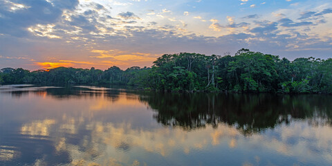 Amazon rainforest river panorama at sunrise, Yasuni national park, Ecuador.