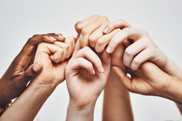 People, group diversity and holding hands isolated on a white background for solidarity, support...
