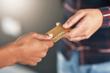 Closeup, hands and man with a credit card, payment and transaction with discount, sales and retail. Zoom, buyer and shopper with banking, shopping and customer with plastic, paying and services