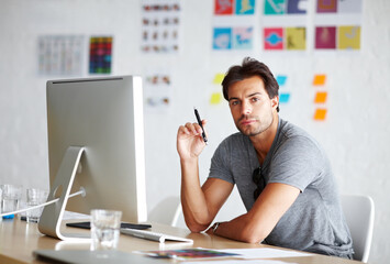 Computer, portrait and pen for man planning, ideas and creativity for online career, graphic design and website. Creative, face and serious person on desktop pc, startup business and office workplace