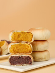 Cake made with purple sweet potato and pumpkin, moon cake, traditional Chinese pastry