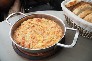 Turkish Menemen omelet in a frying pan. .
