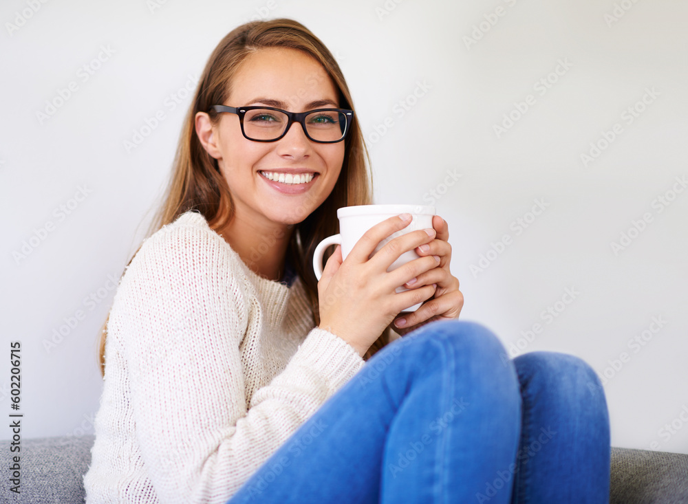 Poster Portrait, coffee and smile of woman in home enjoying caffeine, espresso or cappuccino in living room. Happiness, tea and female person with glasses on sofa, drinking beverage and relax in house alone