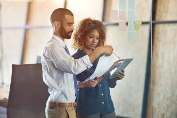 Coworkers, modern office or planning and brainstorming with a tablet and paper, sticky notes for...