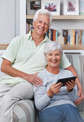 Portrait, senior couple and smile with tablet, sofa and home for social media, online news app and ebook. Happy old man, woman and digital technology for subscription, website and internet connection